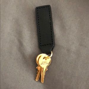 Yves Saint Laurent keys on leather fabric piece